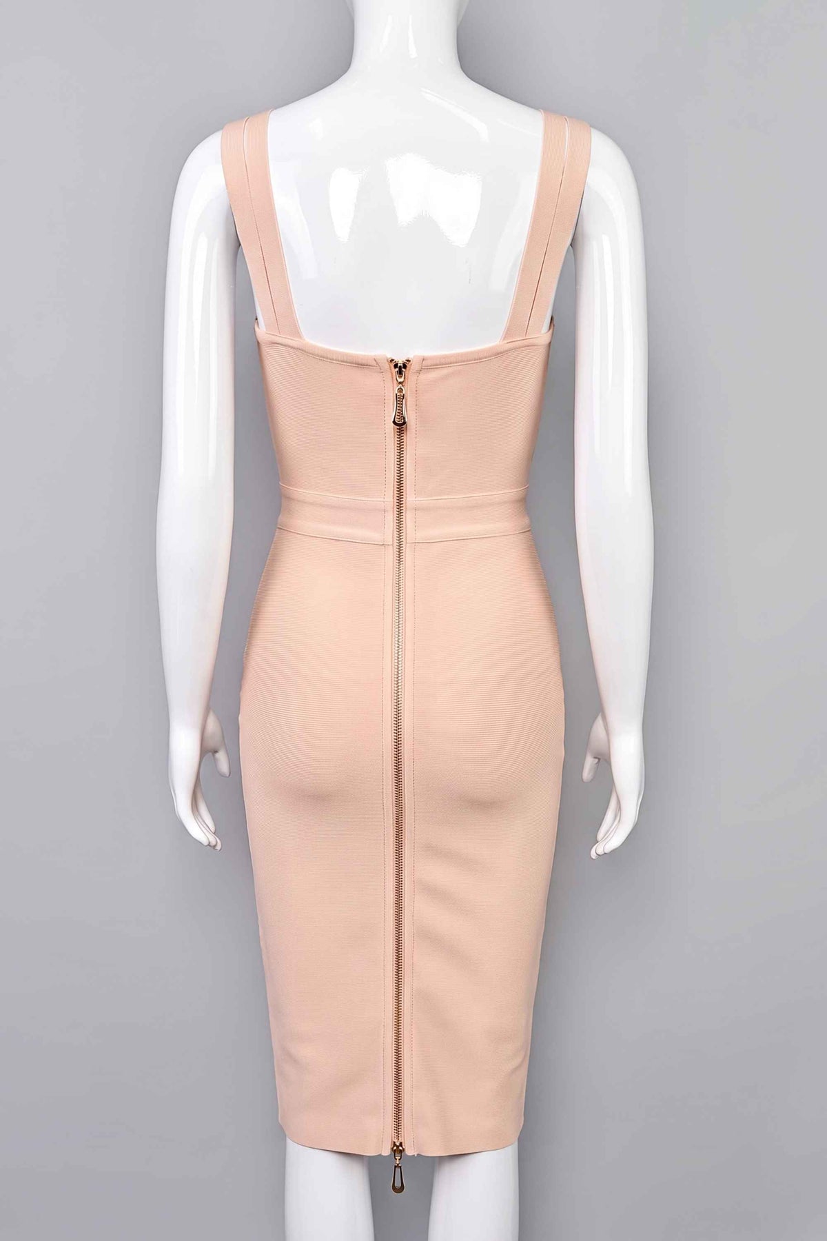 Woman wearing a figure flattering  Kate Bandage Dress - Nude Bodycon Collection