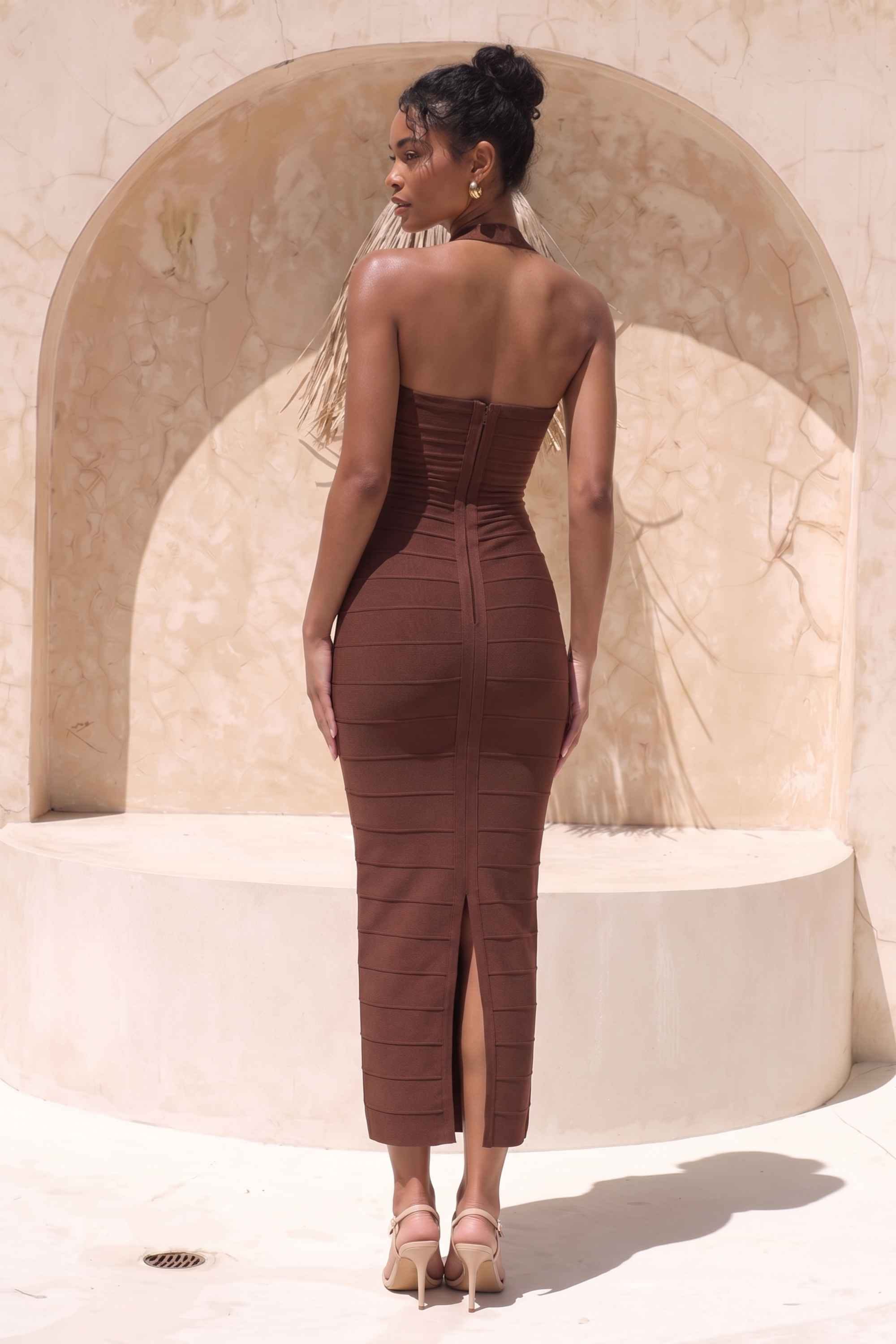 Woman wearing a figure flattering  Kia Bandage Maxi Dress - Chocolate Brown BODYCON COLLECTION Pty Ltd