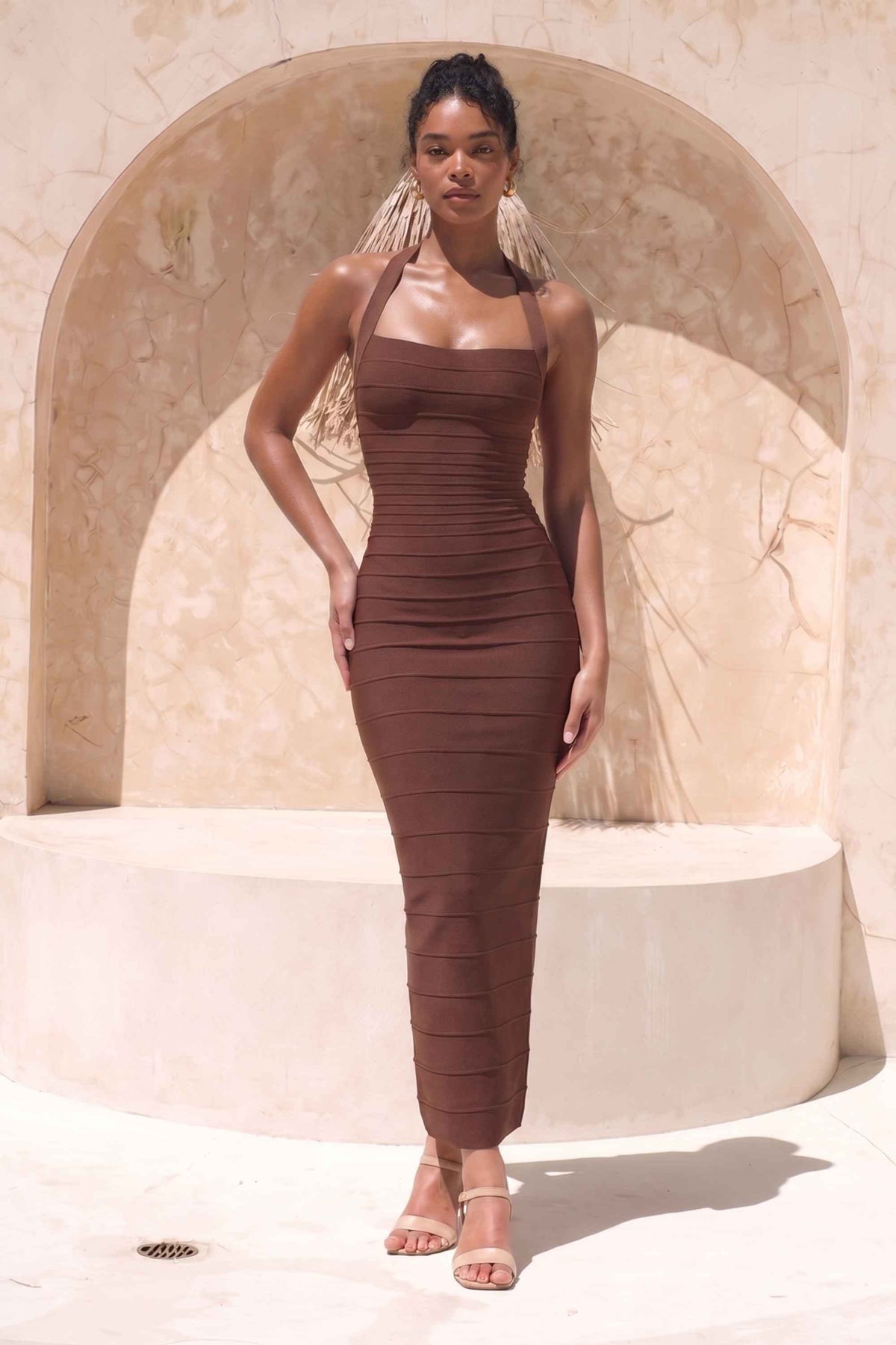 Woman wearing a figure flattering  Kia Bandage Maxi Dress - Chocolate Brown BODYCON COLLECTION Pty Ltd