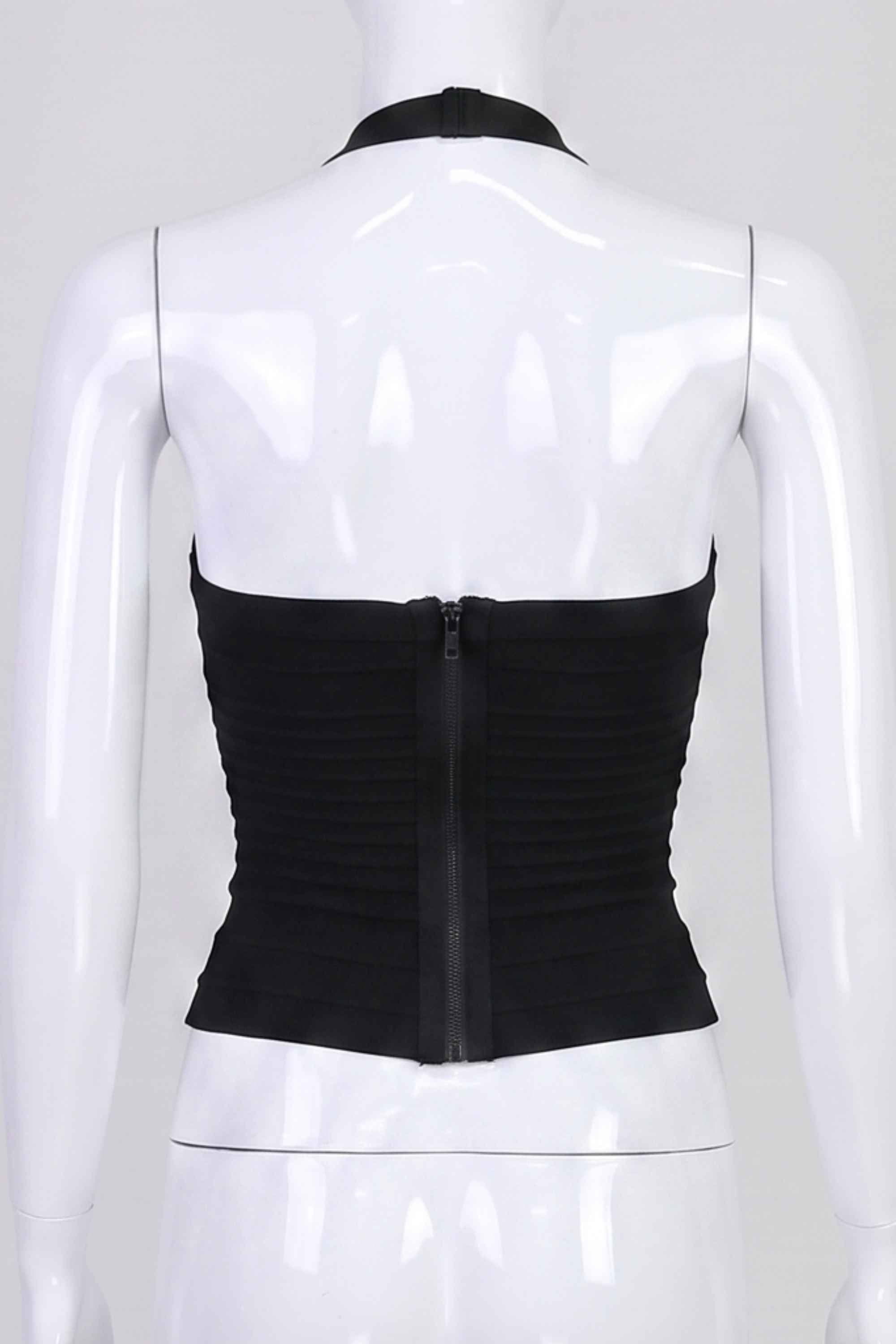 Woman wearing a figure flattering  Kia Bandage Top - Classic Black BODYCON COLLECTION Pty Ltd