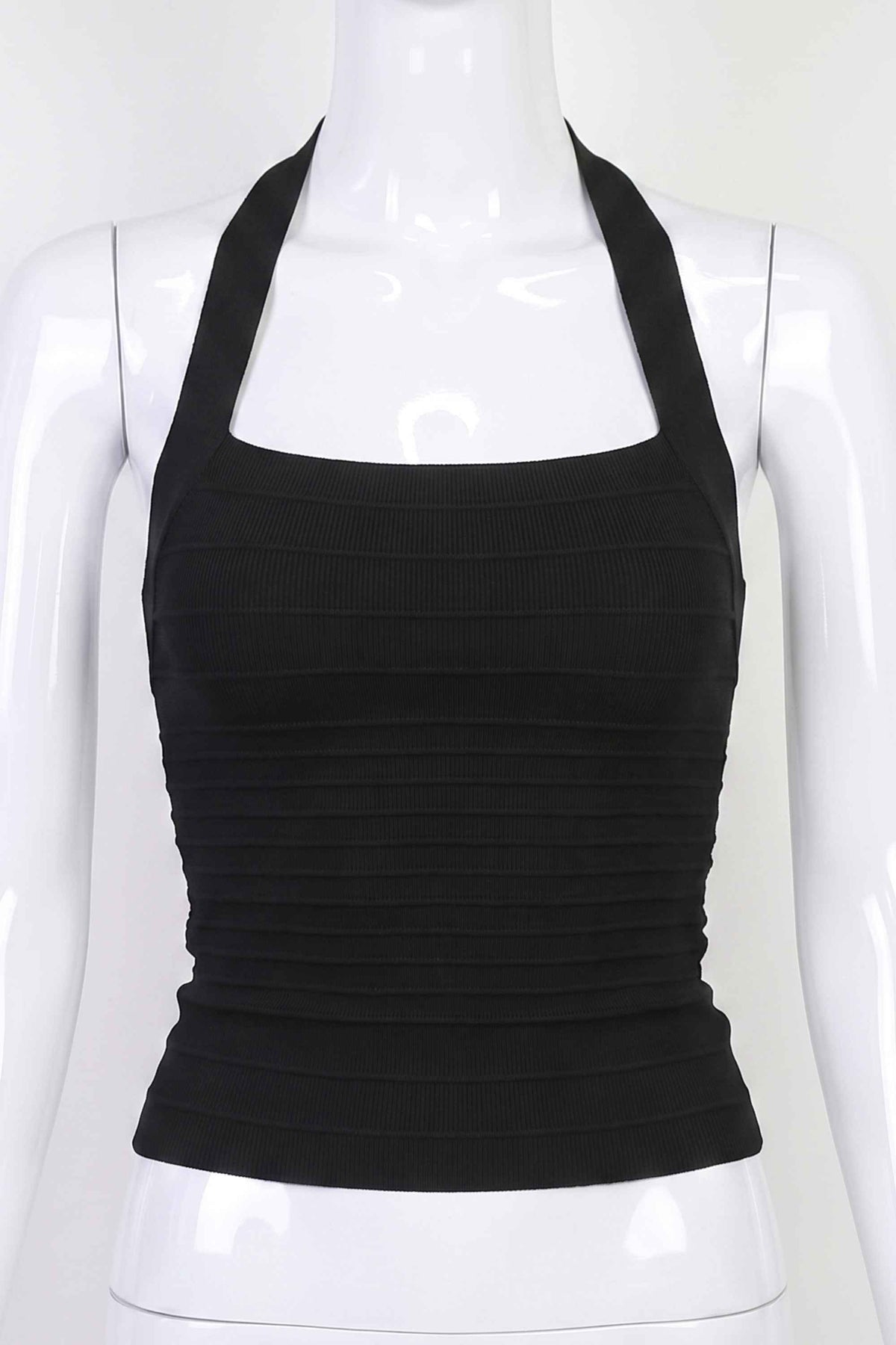 Woman wearing a figure flattering  Kia Bandage Top - Classic Black BODYCON COLLECTION Pty Ltd