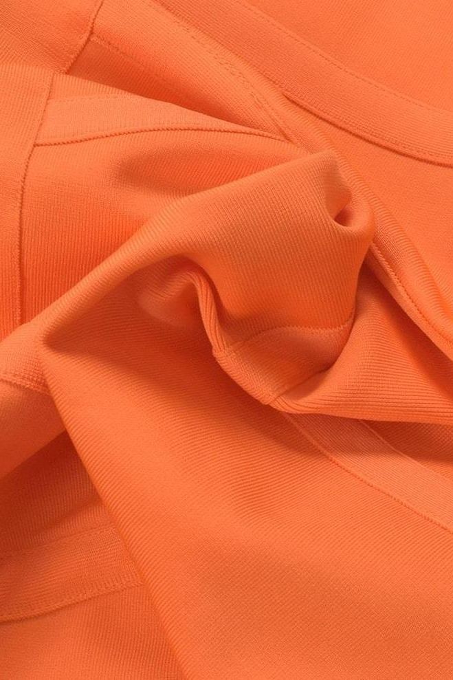 Woman wearing a figure flattering  Kit Bandage Dress - Apricot Orange Bodycon Collection