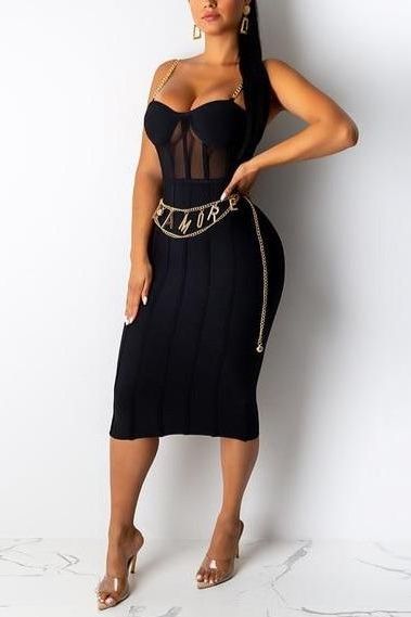 Woman wearing a figure flattering  Leah Bodycon Dress - Classic Black Bodycon Collection