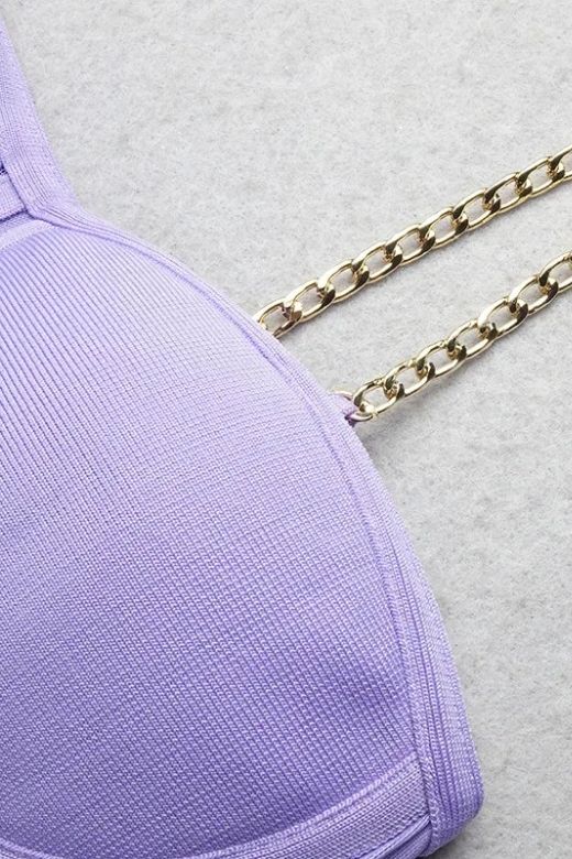 Woman wearing a figure flattering  Leah Bodycon Dress - Violet Purple Bodycon Collection