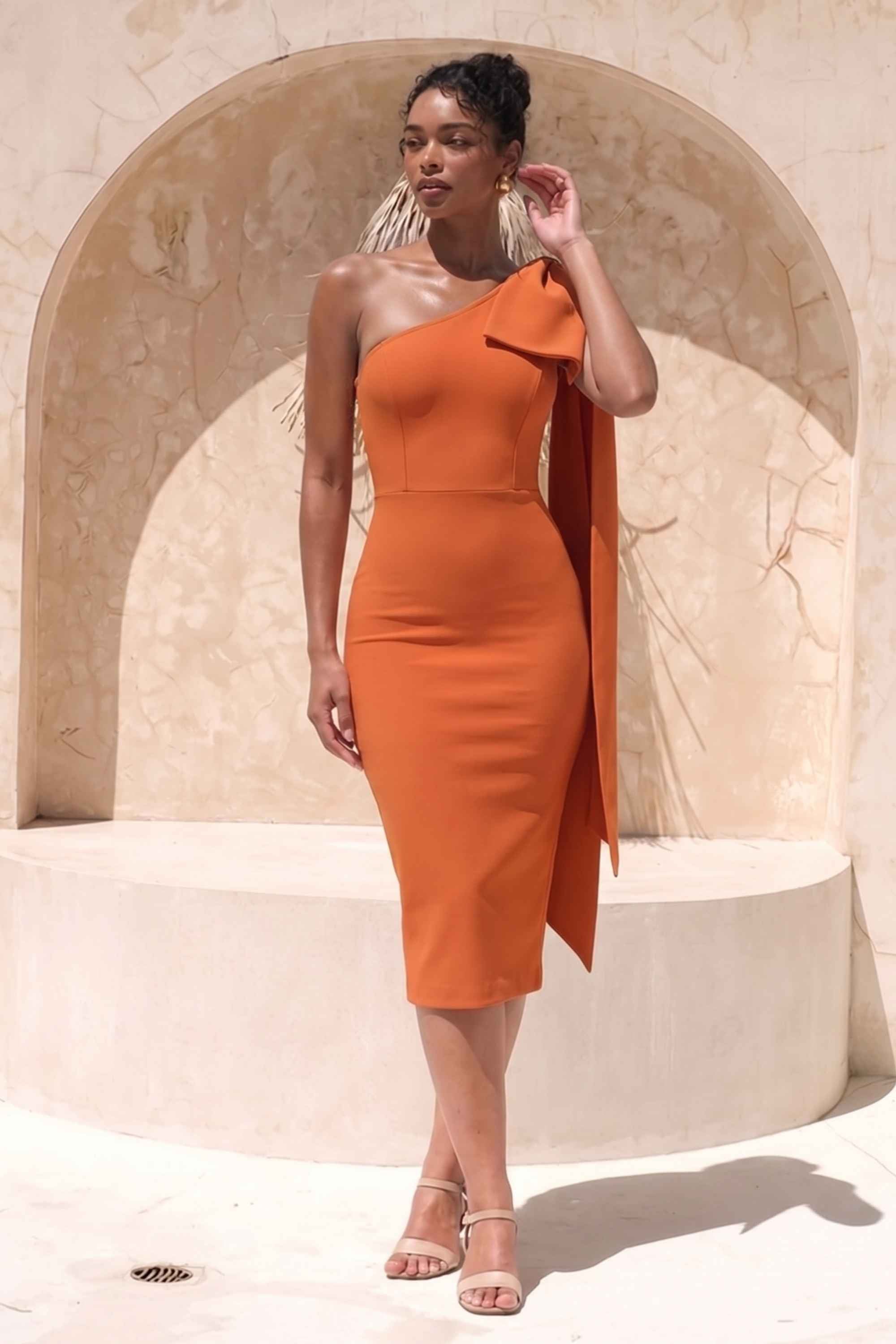 Woman wearing a figure flattering  Lela Long Sleeve Bandage Midi Dress - Apricot Orange BODYCON COLLECTION