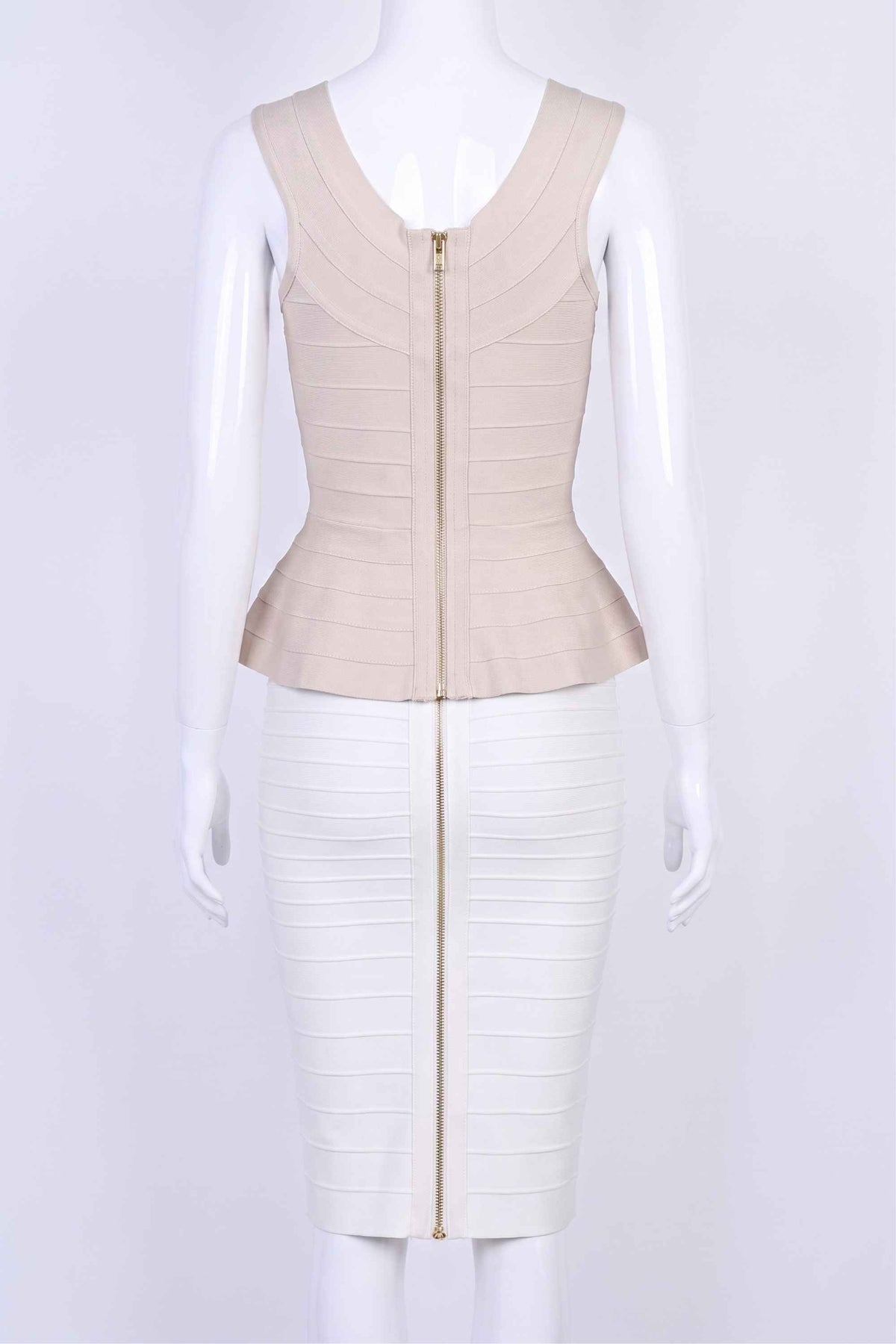 Woman wearing a figure flattering  Leni Bandage Peplum Top - Beige BODYCON COLLECTION