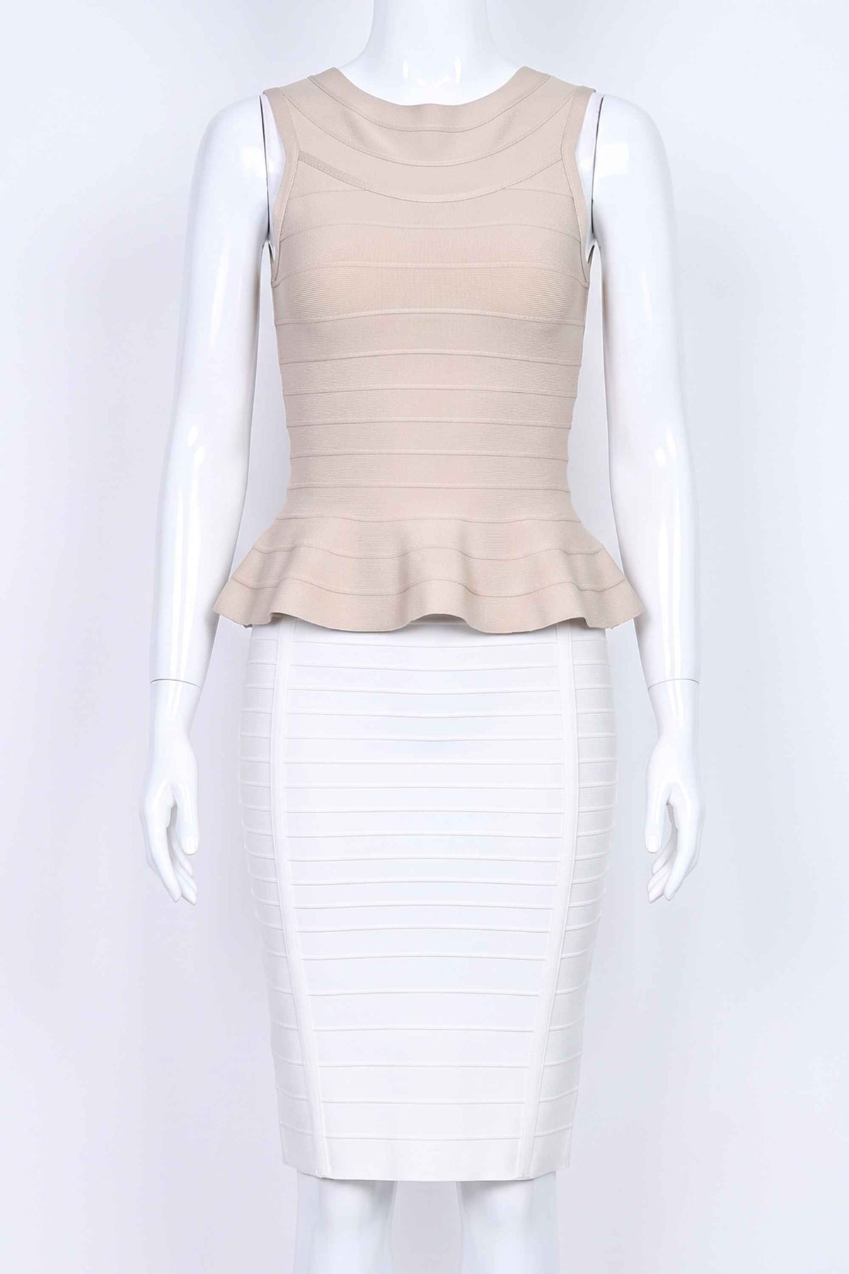 Woman wearing a figure flattering  Leni Bandage Peplum Top - Beige BODYCON COLLECTION