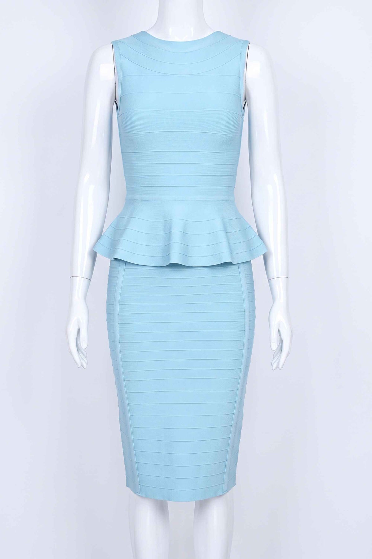Woman wearing a figure flattering  Leni Bandage Top - Sky Blue BODYCON COLLECTION