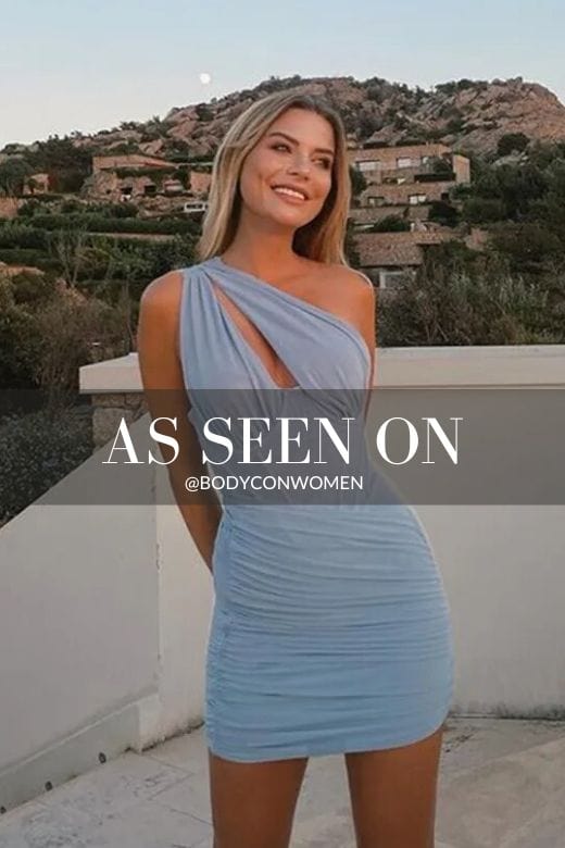 Woman wearing a figure flattering  Lily Bodycon Wrap Mini Dress - Sky Blue BODYCON COLLECTION