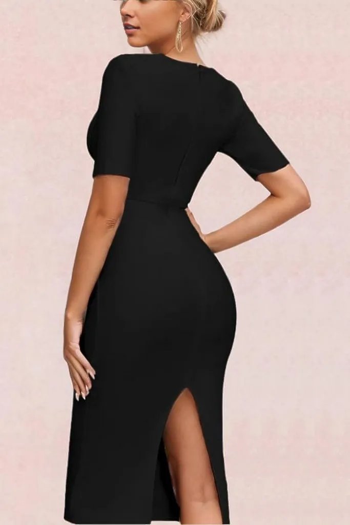 Woman wearing a figure flattering  Lola Short Sleeve Bodycon Midi Dress - Classic Black BODYCON COLLECTION