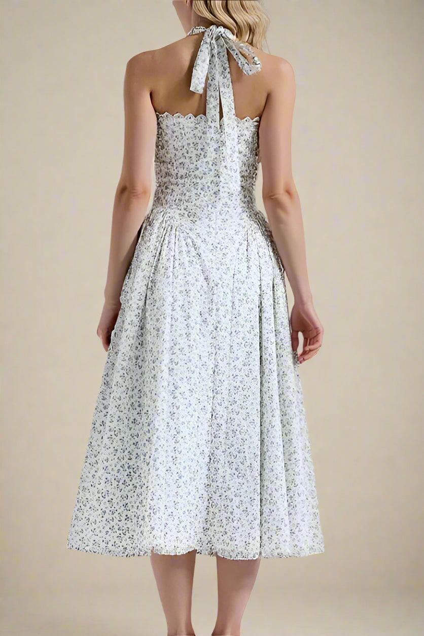Woman wearing a figure flattering  Lynsie Bodycon Midi Dress - Blue Floral BODYCON COLLECTION