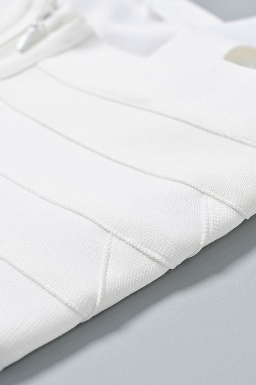 Woman wearing a figure flattering  Madelyn Bandage Mini Dress - White Pearl BODYCON COLLECTION Pty Ltd