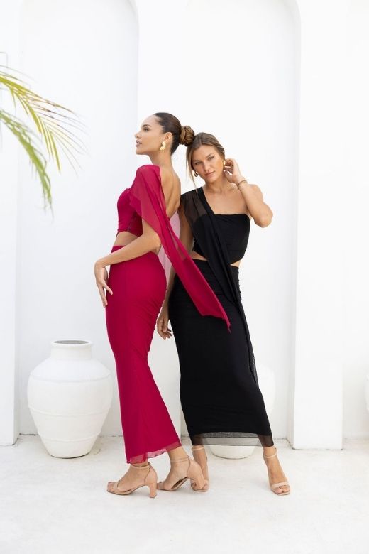 Woman wearing a figure flattering  Margot Wrap Top and Maxi Skirt Outfit Set - Red Wine BODYCON COLLECTION