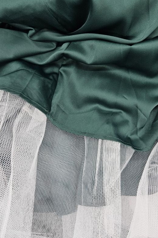 Woman wearing a figure flattering  Mavis Midi Dress - Emerald Green BODYCON COLLECTION