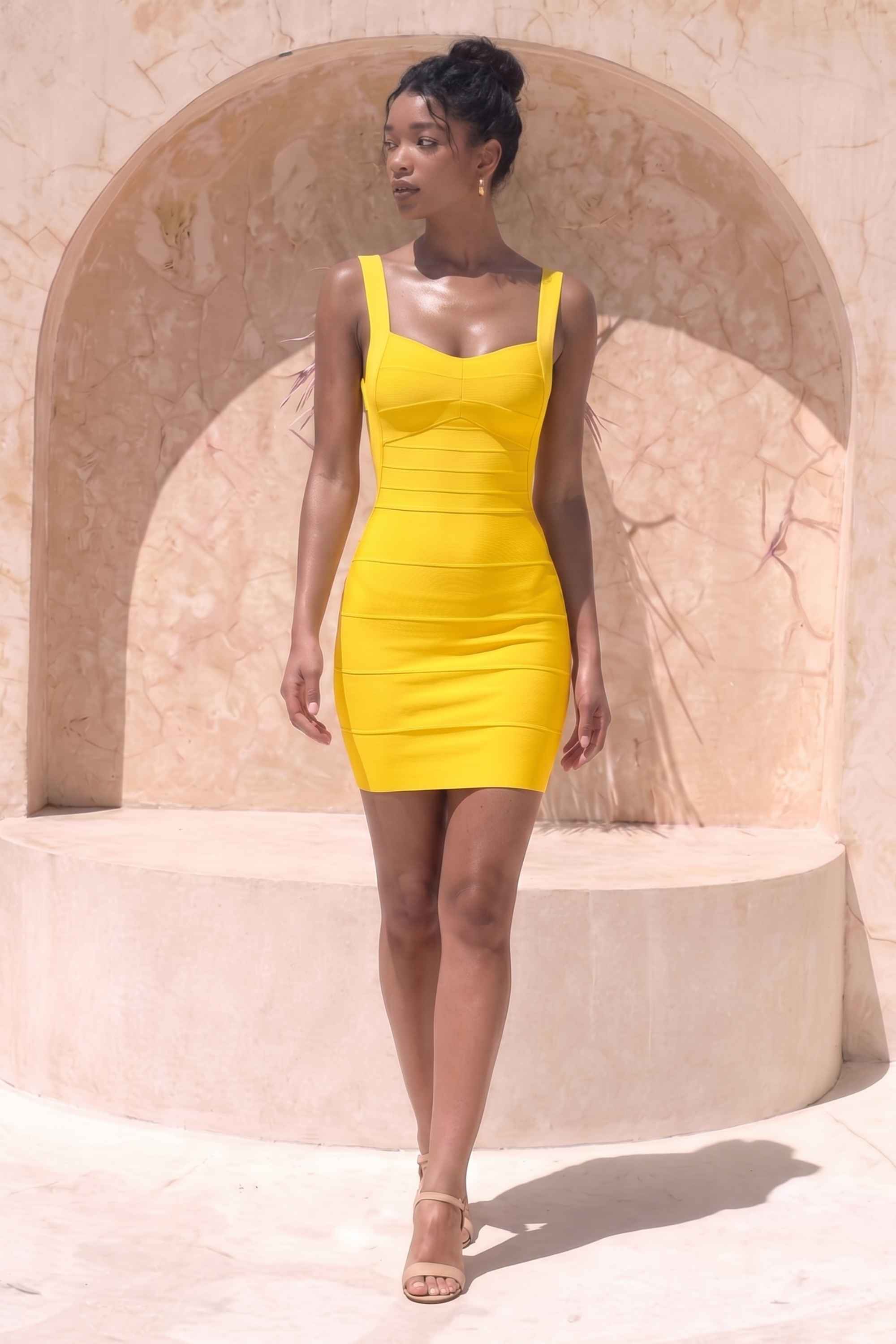 Woman wearing a figure flattering  Maya Bandage Mini Dress - Sun Yellow BODYCON COLLECTION