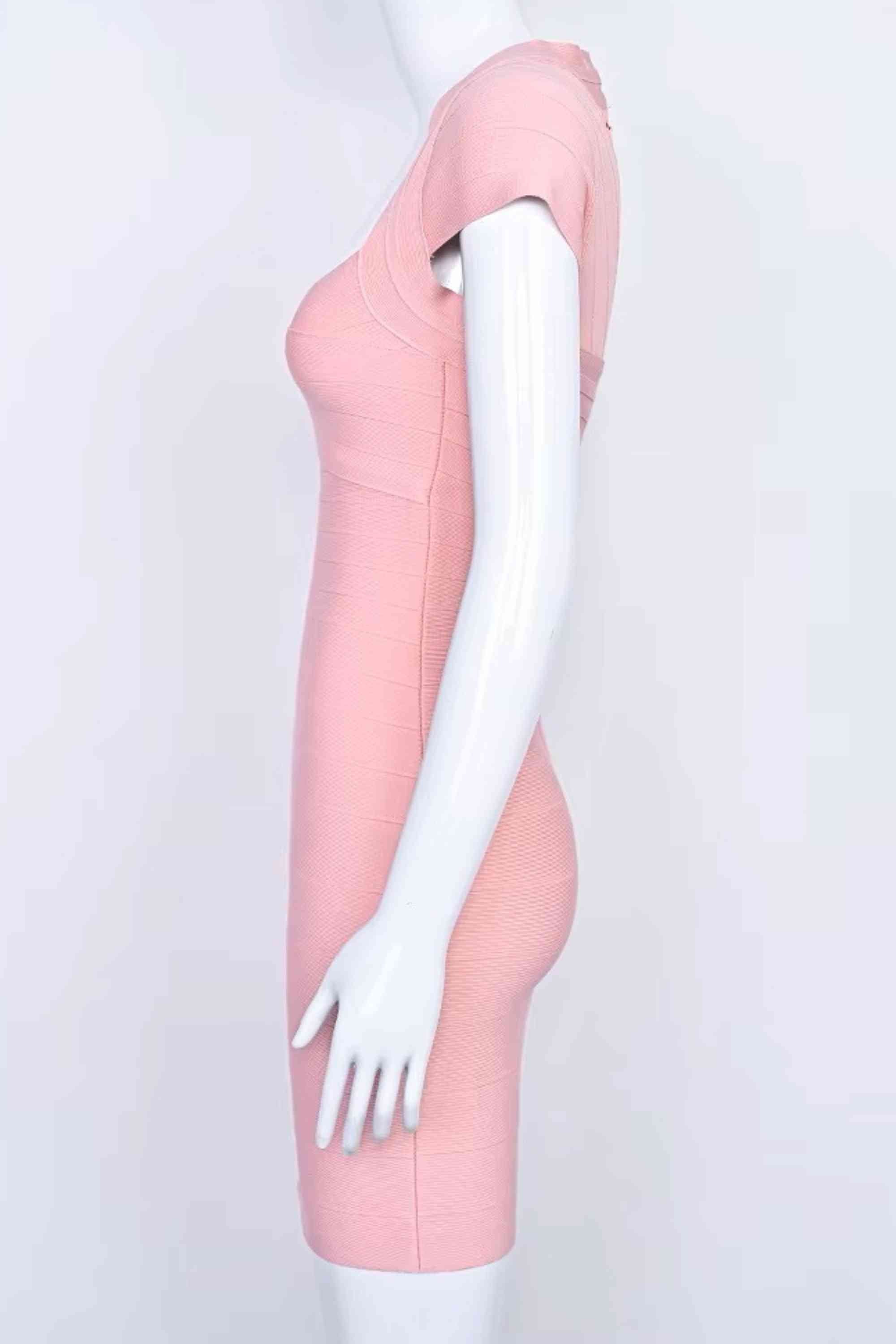 Woman wearing a figure flattering  Miranda Bandage Mini Dress - Ballet Pink Bodycon Collection