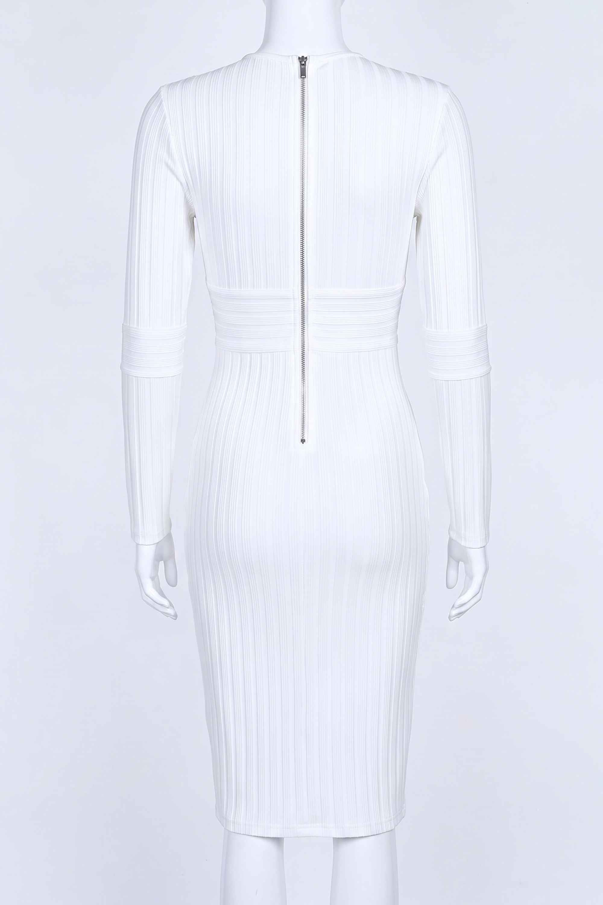 Woman wearing a figure flattering  Olivia Long Sleeve Bandage Dress - White Pearl Bodycon Collection