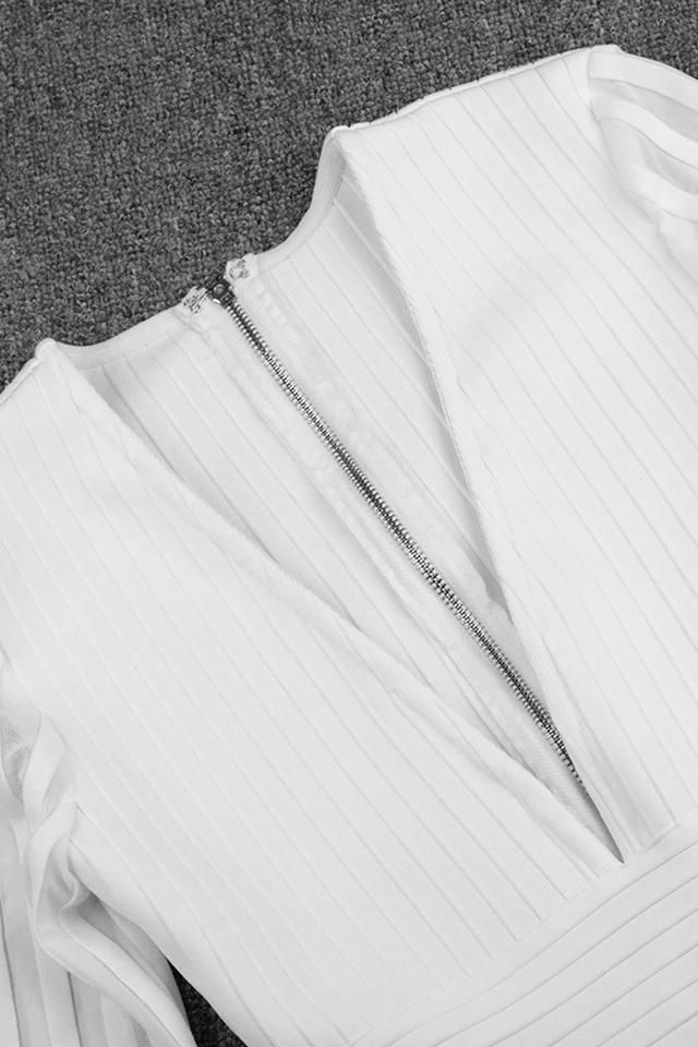 Woman wearing a figure flattering  Olivia Long Sleeve Bandage Midi Dress - Classic Black Bodycon Collection