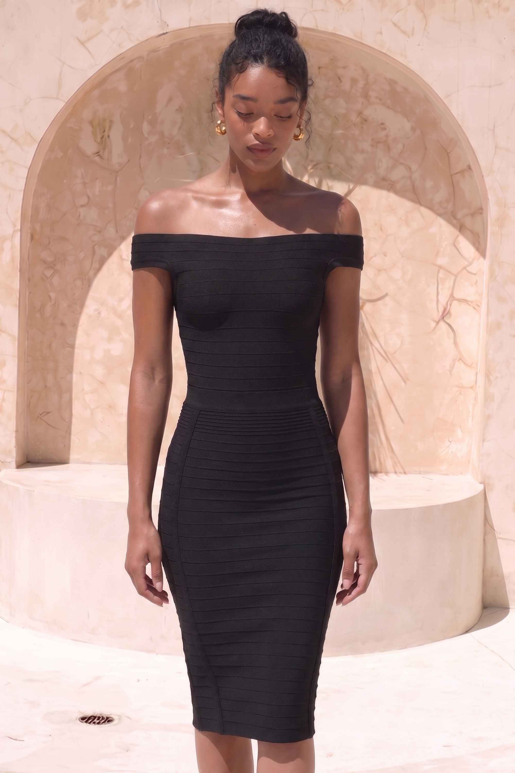 Woman wearing a figure flattering  Pencil High Waist Bandage Knee Length Knitted Skirt - Classic Black BODYCON COLLECTION