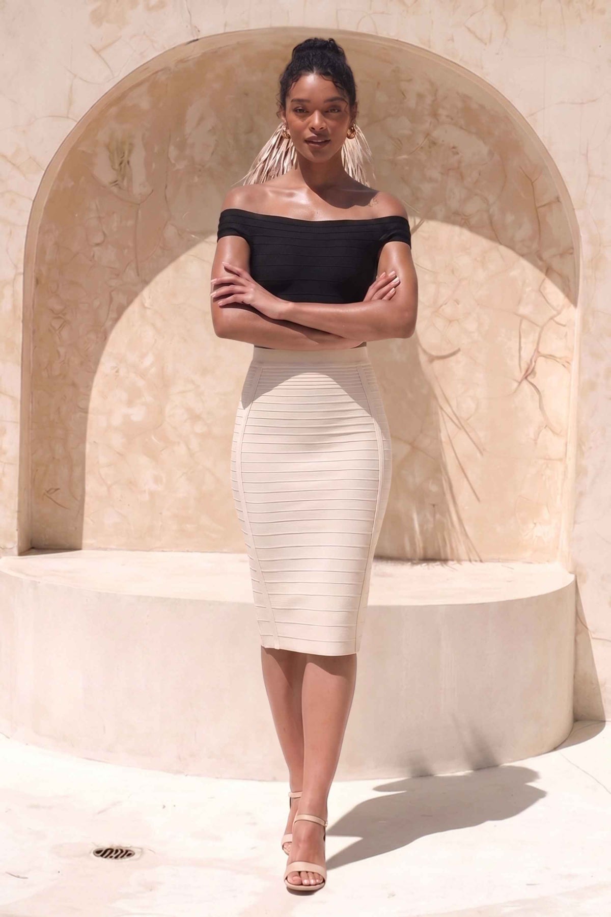 Woman wearing a figure flattering  Pencil High Waist Bandage Knee Length Knitted Skirt - Cream BODYCON COLLECTION