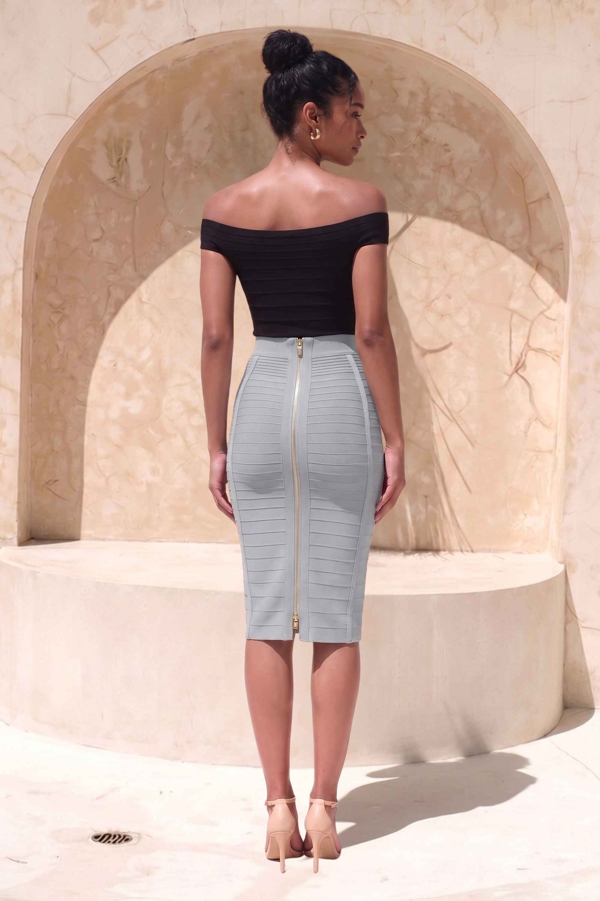 Woman wearing a figure flattering  Pencil High Waist Bandage Knee Length Knitted Skirt - Steel Grey BODYCON COLLECTION