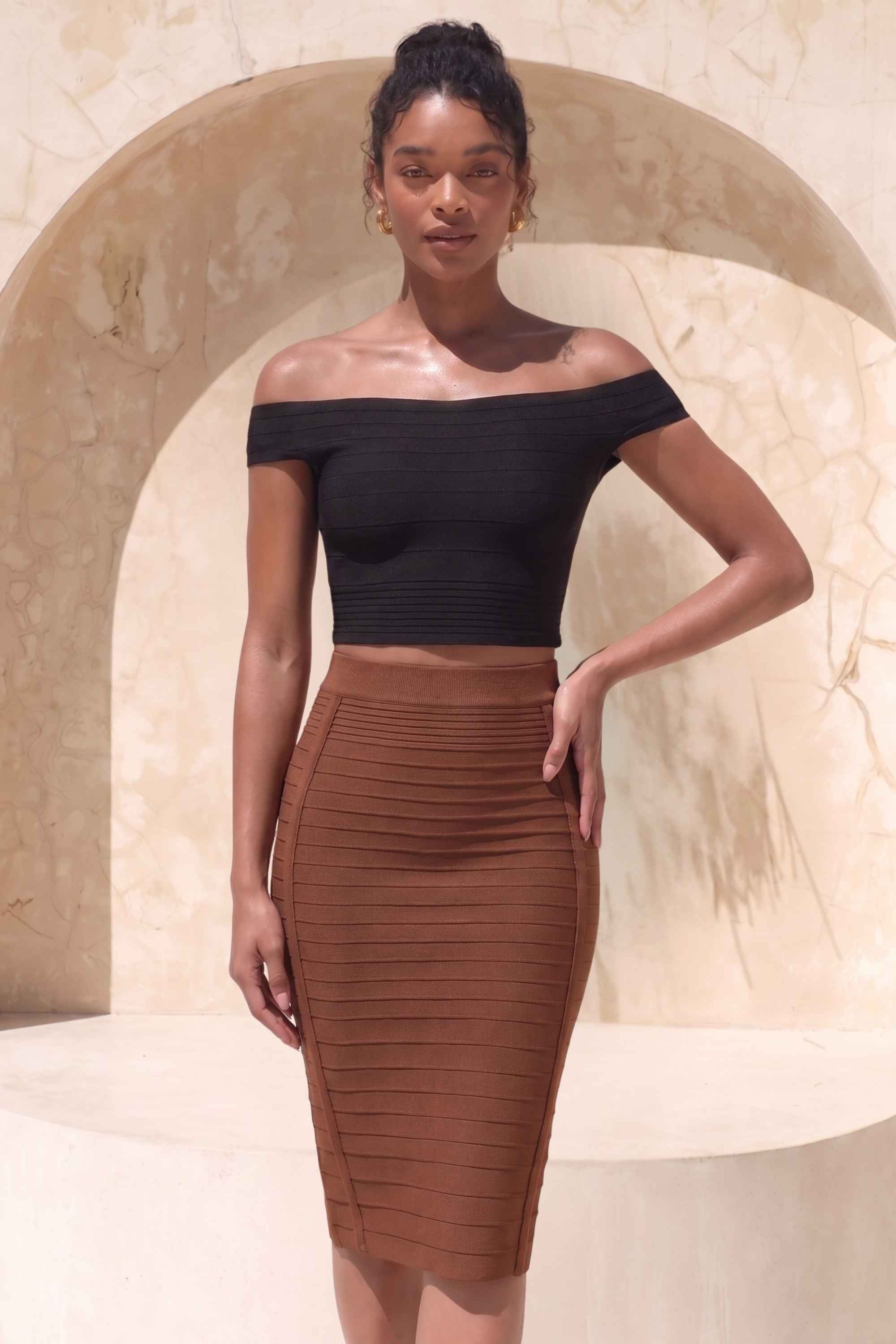 Woman wearing a figure flattering  Pencil High Waist Bandage Knee Length Knitted Skirt - Tan Brown BODYCON COLLECTION