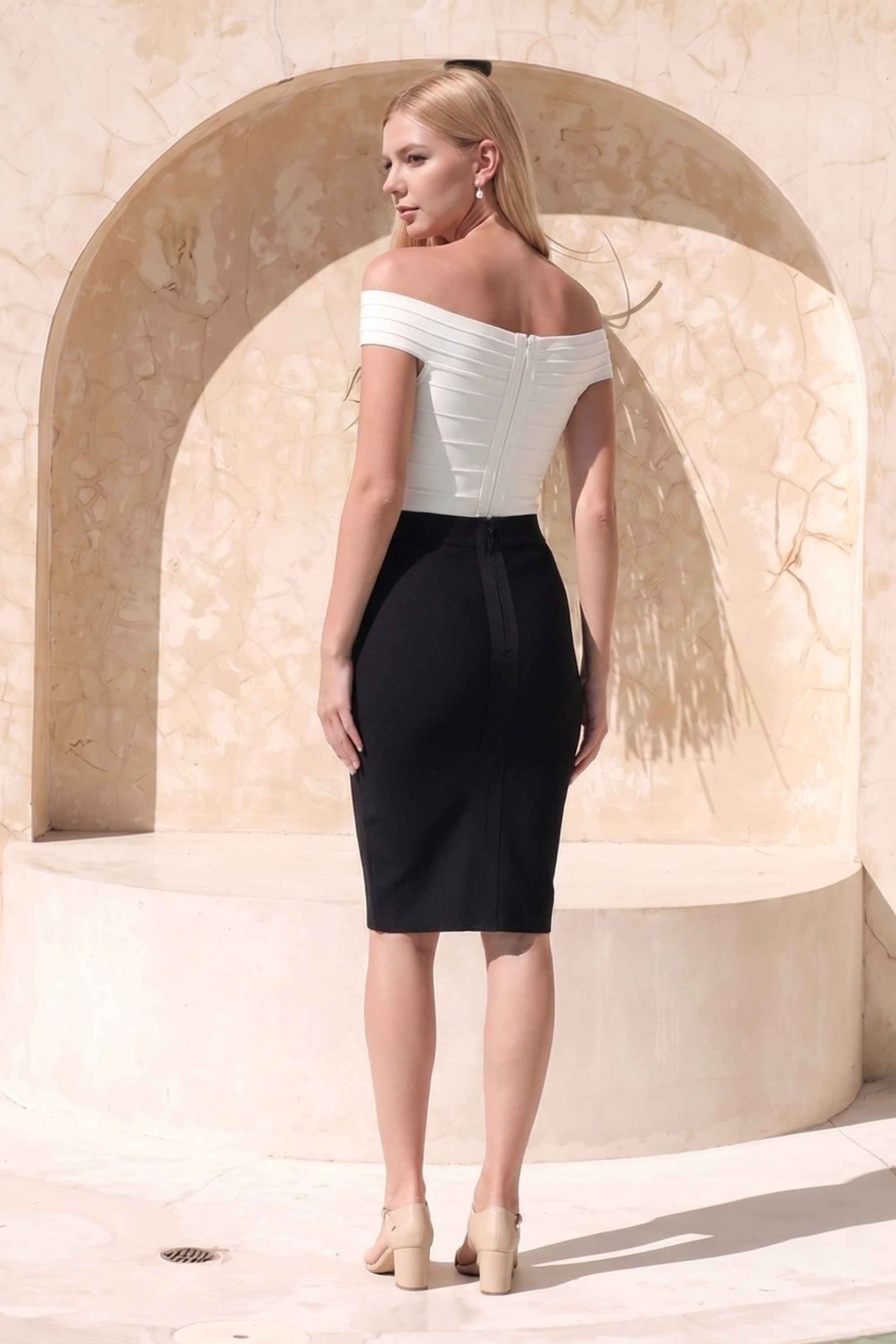 Woman wearing a figure flattering  Pencil High Waist Bandage Knee Length Skirt - Classic Black BODYCON COLLECTION