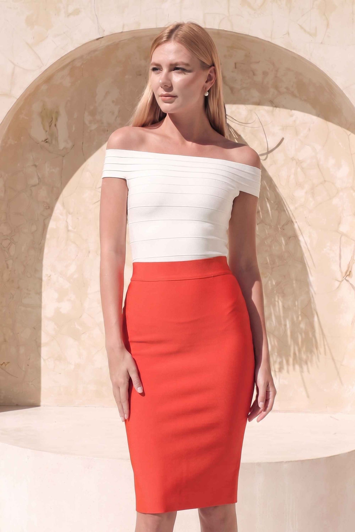 Woman wearing a figure flattering  Pencil High Waist Bandage Knee Length Skirt - Lipstick Red BODYCON COLLECTION