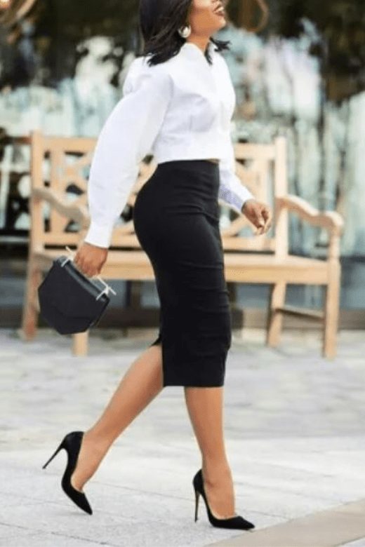Woman wearing a figure flattering  Pencil High Waist Leather Metallic Midi Skirt - Classic Black BODYCON COLLECTION