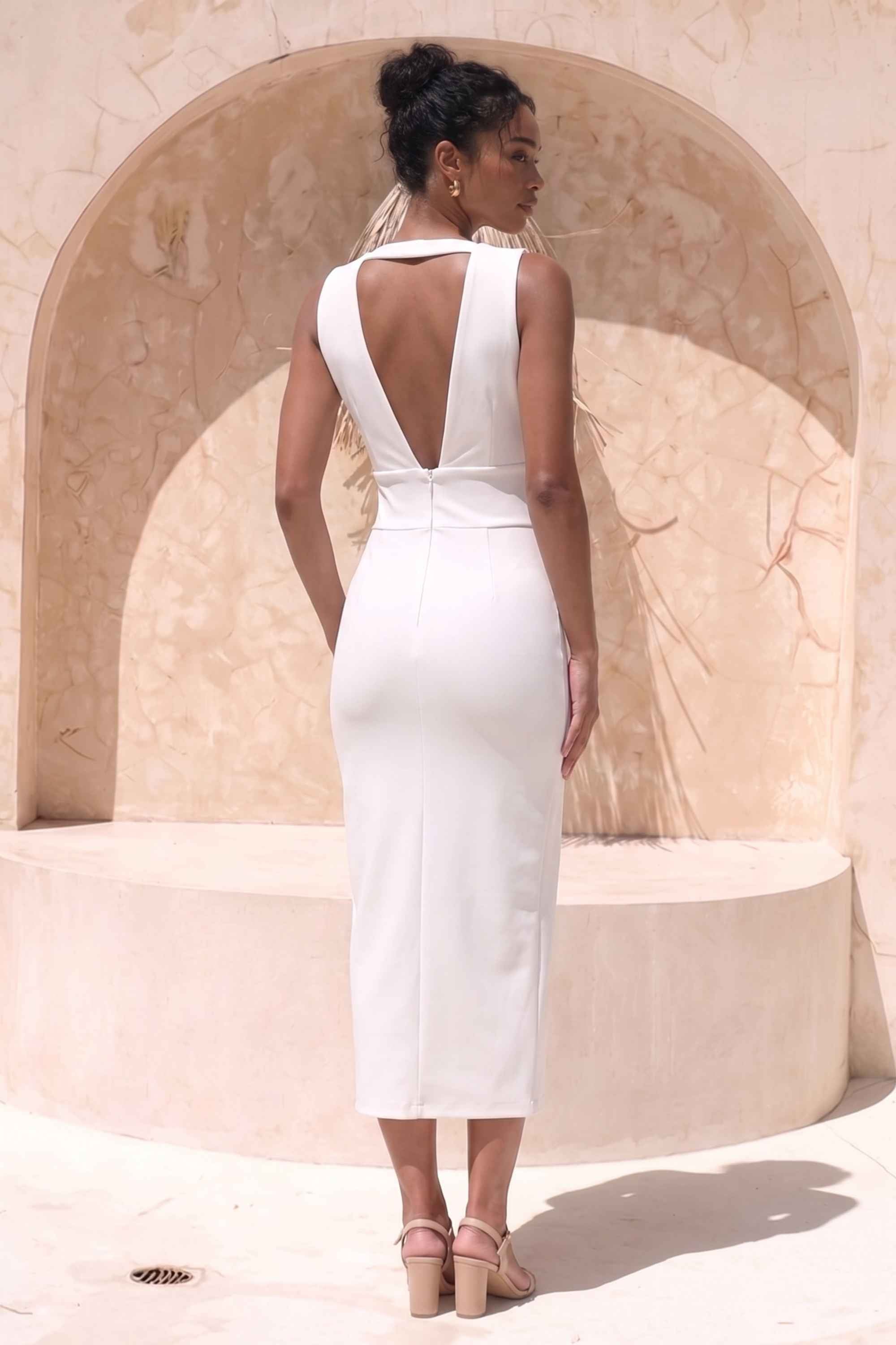 Woman wearing a figure flattering  Pia Bandage Midi Dress - Pearl White BODYCON COLLECTION