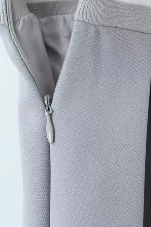 Woman wearing a figure flattering  Pleated Sports Mini Skirt - Cloud Grey BODYCON COLLECTION Pty Ltd