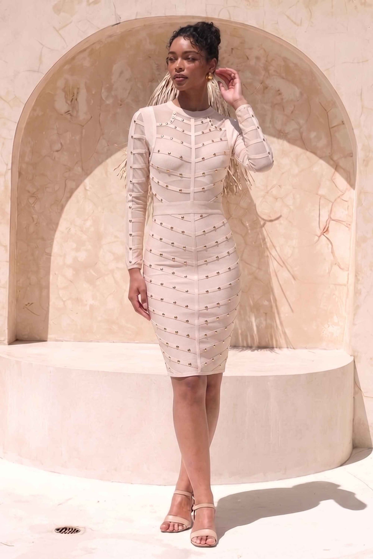 Woman wearing a figure flattering  Rosa Long Sleeve Bodycon Dress - Cream BODYCON COLLECTION
