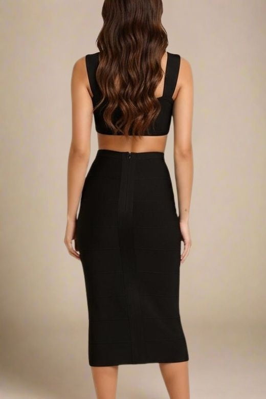Woman wearing a figure flattering  Sasha Bandage Midi Dress - Classic Black BODYCON COLLECTION