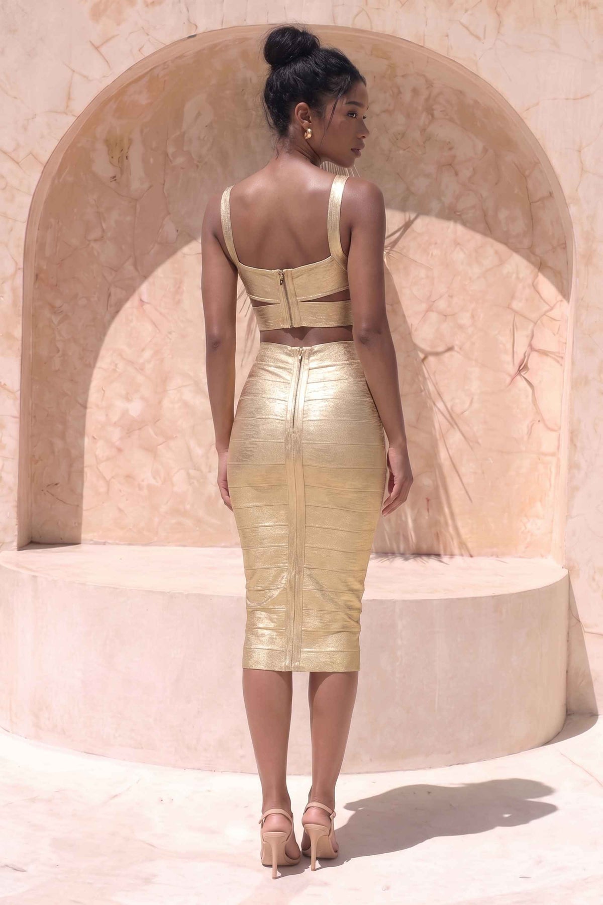 Woman wearing a figure flattering  Selene Bandage Crop Top and Midi Skirt Set - Gold BODYCON COLLECTION Pty Ltd