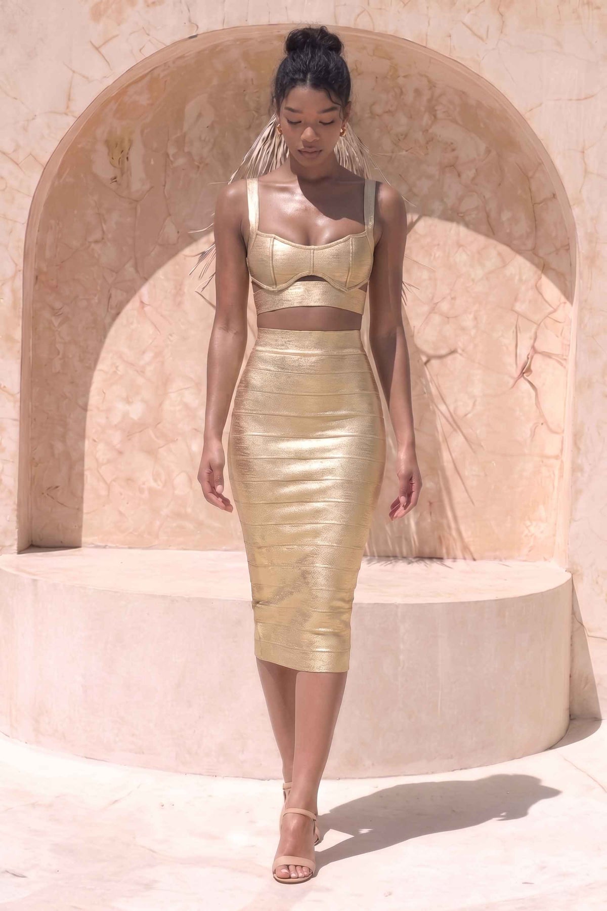 Woman wearing a figure flattering  Selene Bandage Crop Top and Midi Skirt Set - Gold BODYCON COLLECTION Pty Ltd