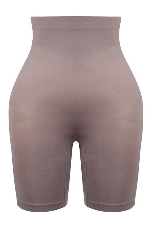 Woman wearing a figure flattering  Shorts Shapewear - Mid Thigh Bodycon Collection