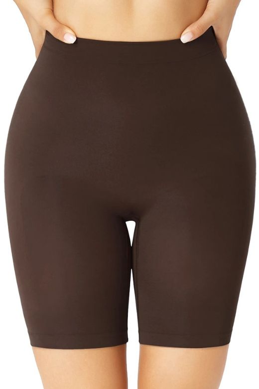 Woman wearing a figure flattering  Shorts Shapewear - Mid Thigh Bodycon Collection