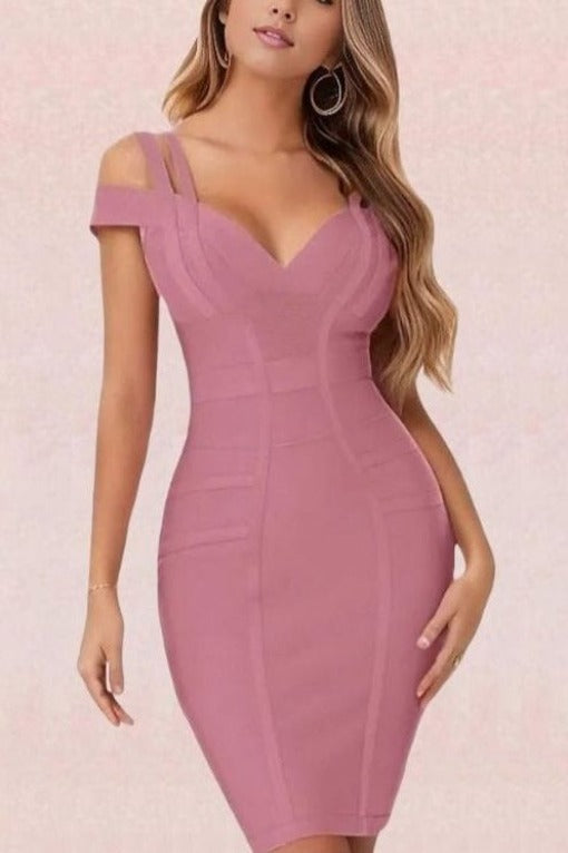 Woman wearing a figure flattering  Sia Bandage Dress - Ballet Pink Bodycon Collection