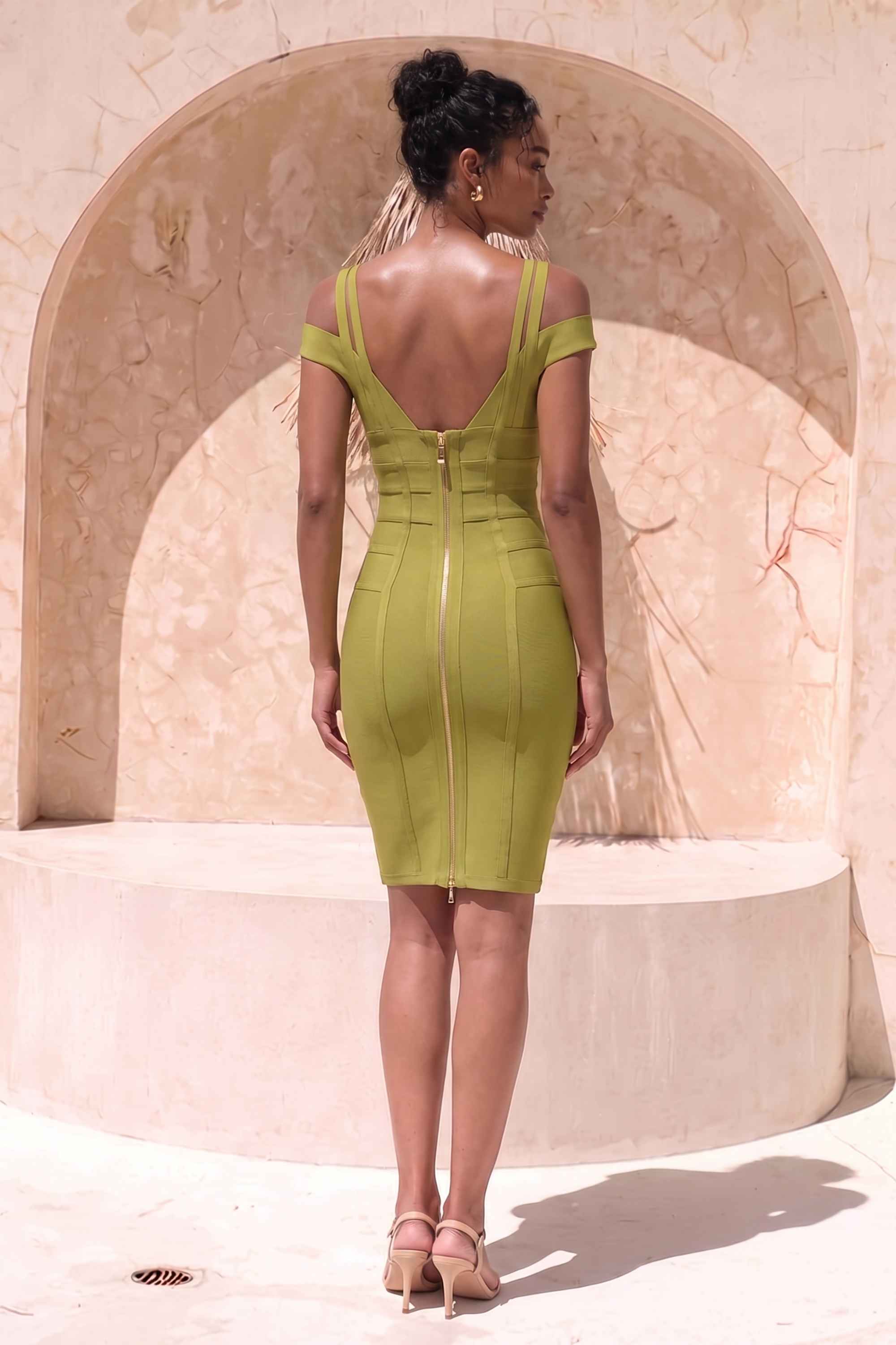 Woman wearing a figure flattering  Sia Bandage Dress - Olive Green Bodycon Collection