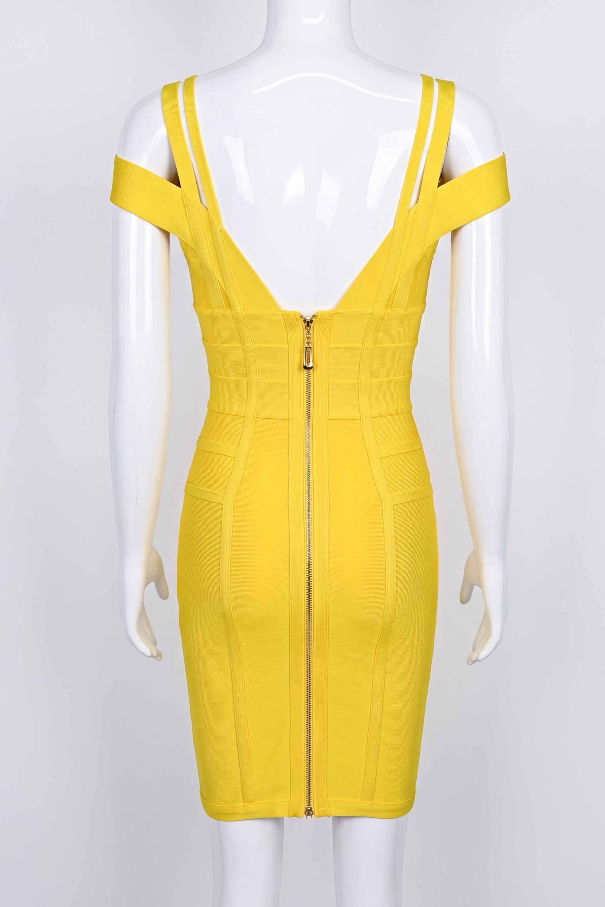 Woman wearing a figure flattering  Sia Bandage Dress - Sun Yellow Bodycon Collection