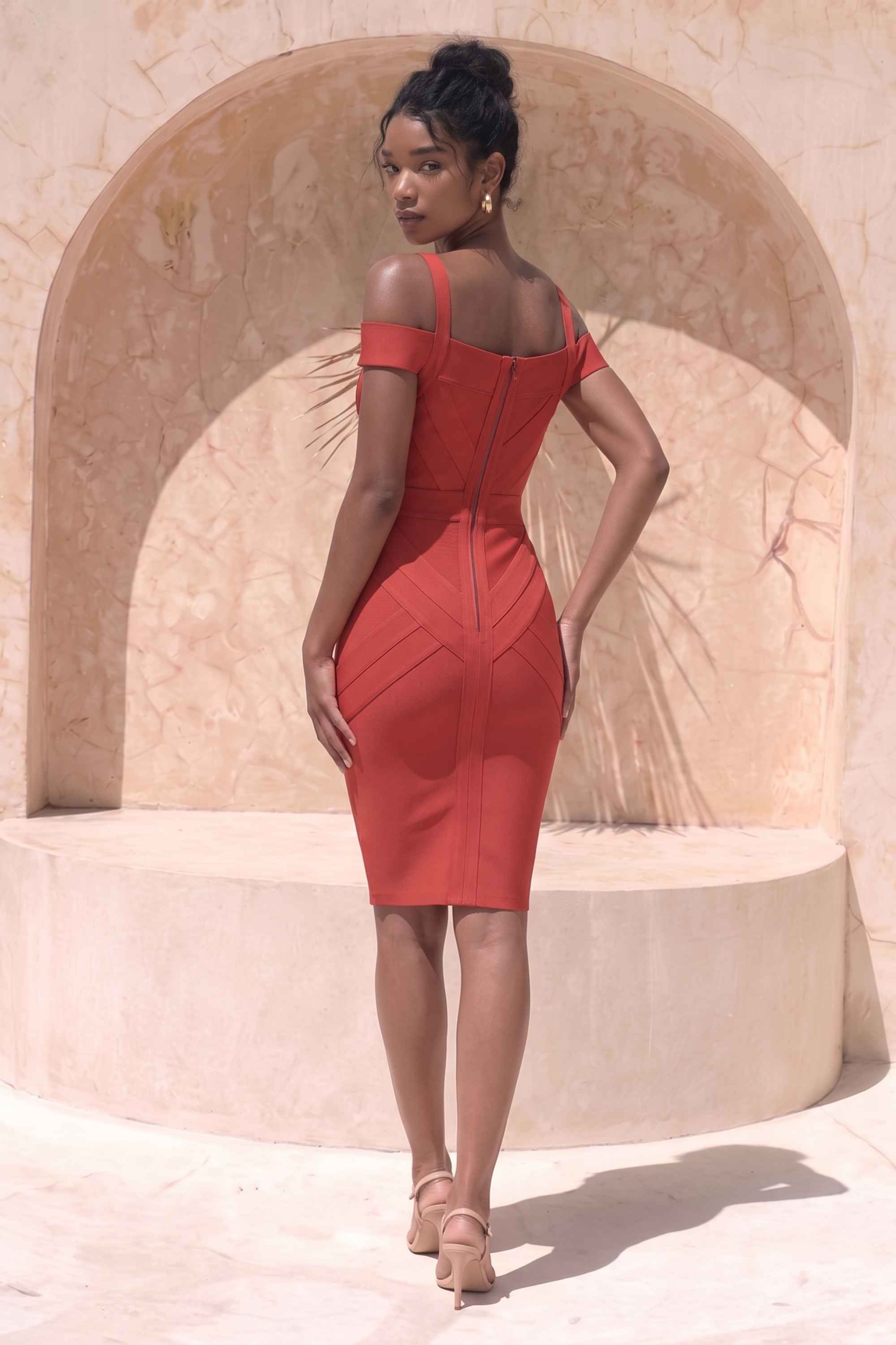 Woman wearing a figure flattering  Sophia Bandage Dress - Lipstick Red Bodycon Collection
