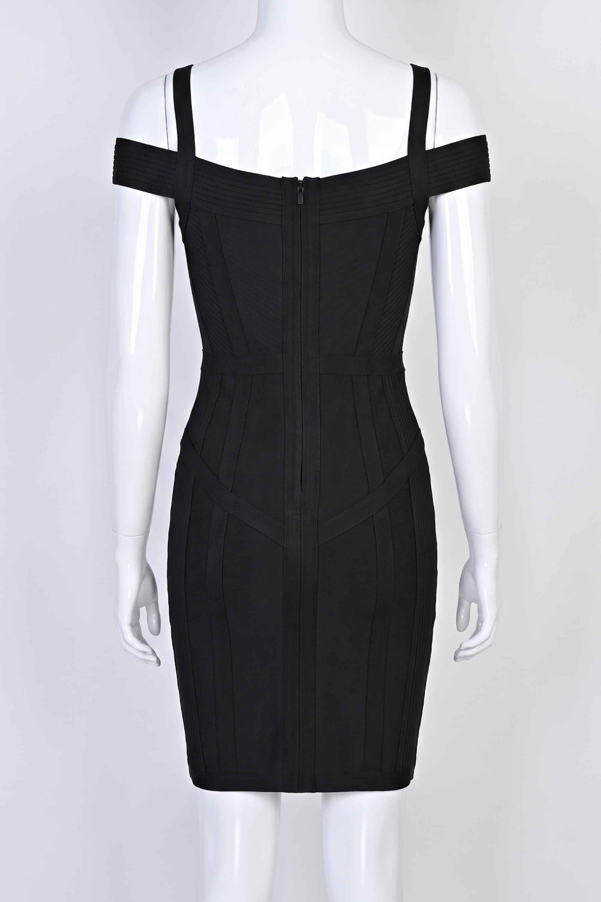 Woman wearing a figure flattering  Sophia Bandage Mini Dress - Classic Black Bodycon Collection
