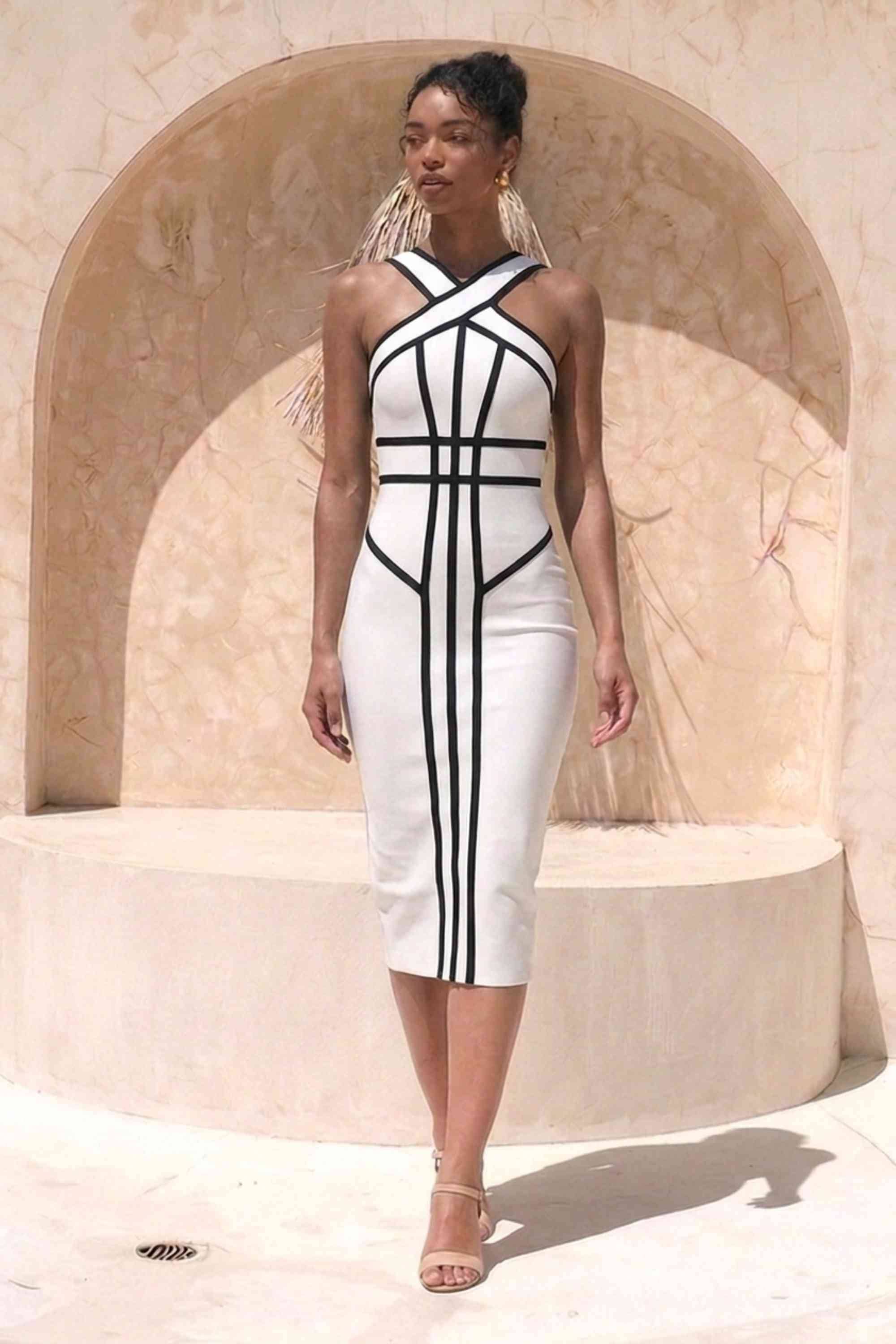 Woman wearing a figure flattering  Suki Bandage Midi Dress - White Pearl BODYCON COLLECTION