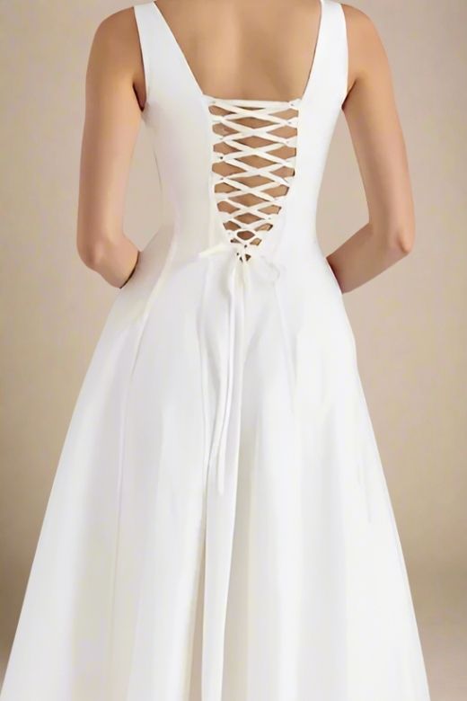 Woman wearing a figure flattering  Willa Midi Dress - White Pearl BODYCON COLLECTION Pty Ltd